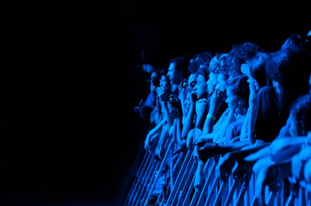 Concert crowd in blue light