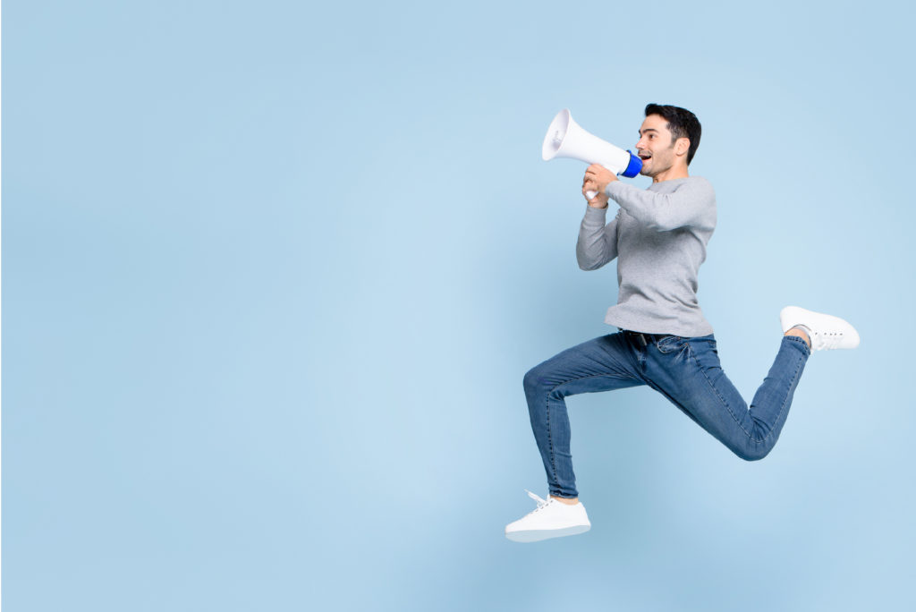 Man with a megaphone, jumping