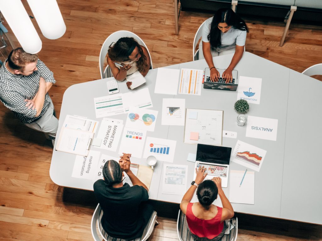 people working around a desk