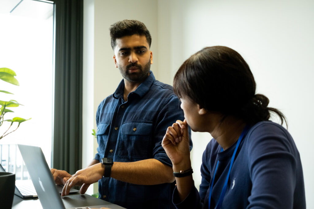 A man speaking to a woman