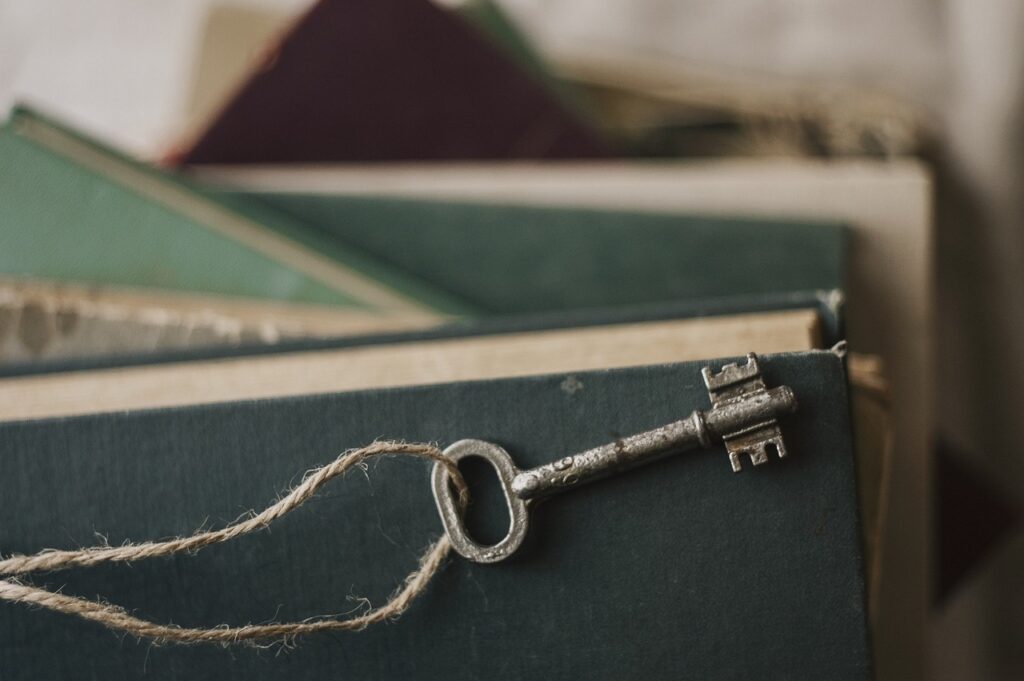 A key resting on a pile of books